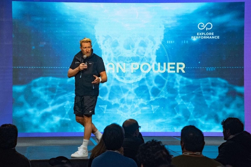 Explore Performance facilitator delivering the Human Power keynote on a conference stage